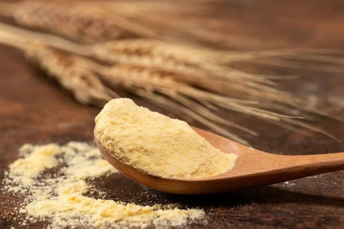 Kamut flour in wooden spoon