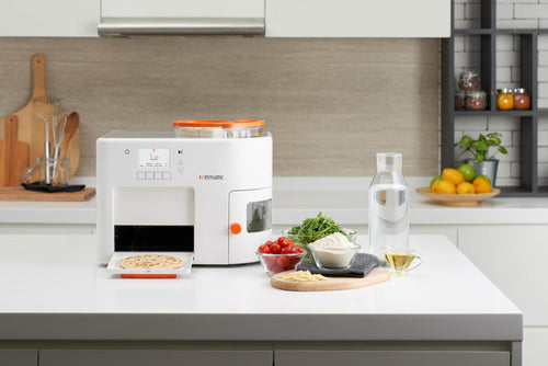A kitchen with a Rotimaker and other items on the kitchen counter
