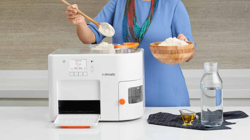 Rotimatic machine with bowl of flour, oil and water