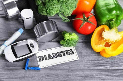 Glucometer, exercise accessories & diabetes healthy food laid on the table